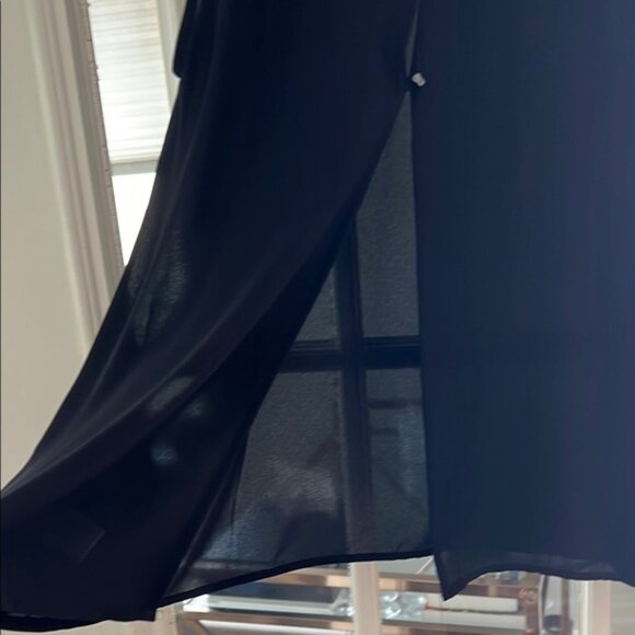 Elegant Black Sleeveless Top with Embellished Neckline - Picture 5 of 5